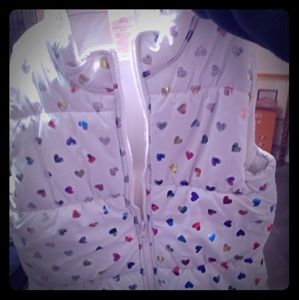Girls puffy vest with multi colored hearutsarys